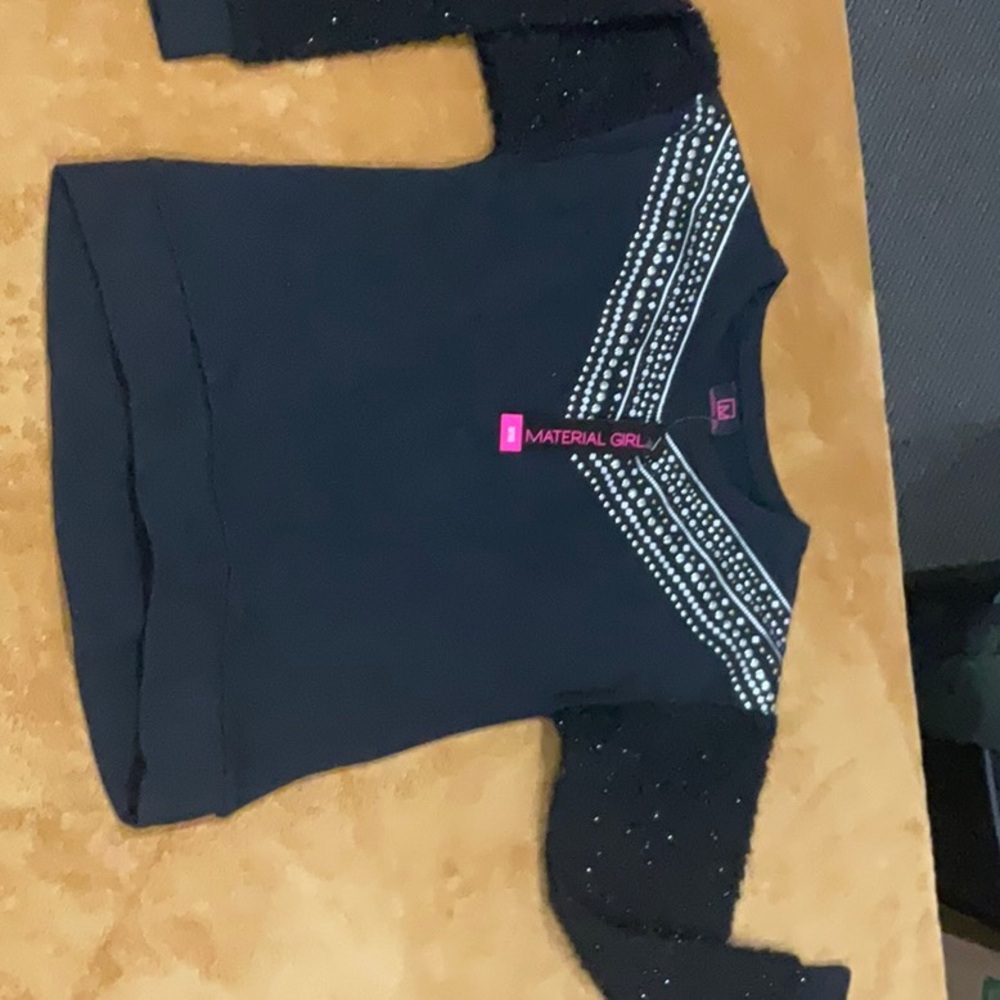 Beaded sweatshirt material with long fluffy sleeves .